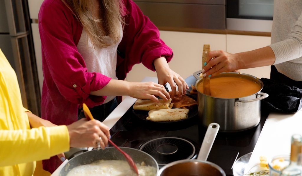 female colleagues making soup