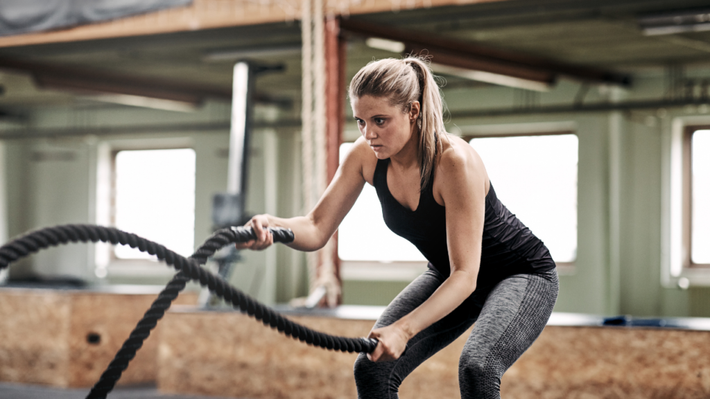 Woman Excercising with Ropes
